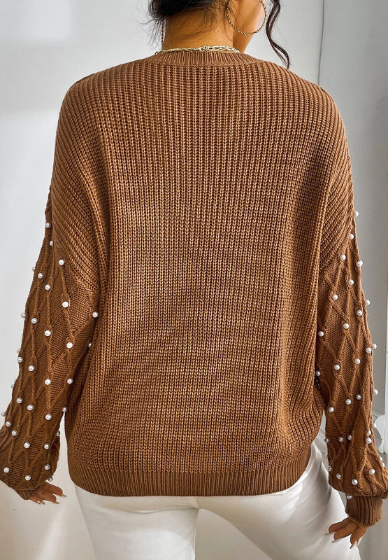 Bella Road sweater with pearl detail on sleeves, round neck, and long sleeves in brown seen from the back. Perfect for elevating style.