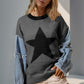 Woman wearing Double Take Full Size Star Pattern Raw Edge Long Sleeve Sweater with unique raw edges and star design