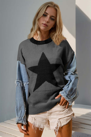 Woman wearing Double Take Full Size Star Pattern Raw Edge Long Sleeve Sweater with unique raw edges and star design