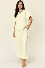 DOUBLE TAKE Full Size Texture Half Zip Short Sleeve Top and Pants Set at Bella Road