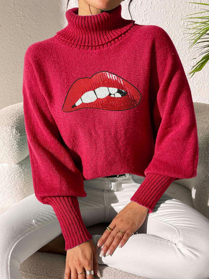 Red Bella Road Lip Turtleneck Sweater with bold lip graphic, worn by model against a light background