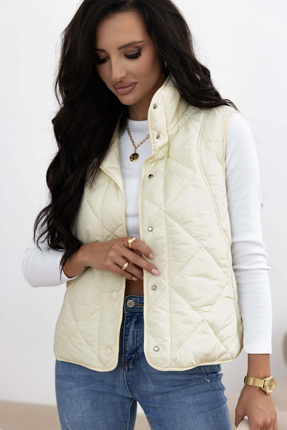 Woman wearing Bella Road ivory snap down texture vest coat with pockets, perfect for fall and winter fashion.