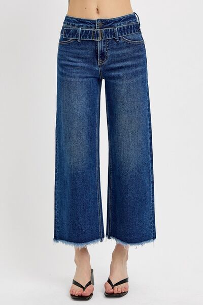 Stylish RISEN Raw Hem Wide Leg Jeans featuring attached buckle details and a trendy, relaxed fit.