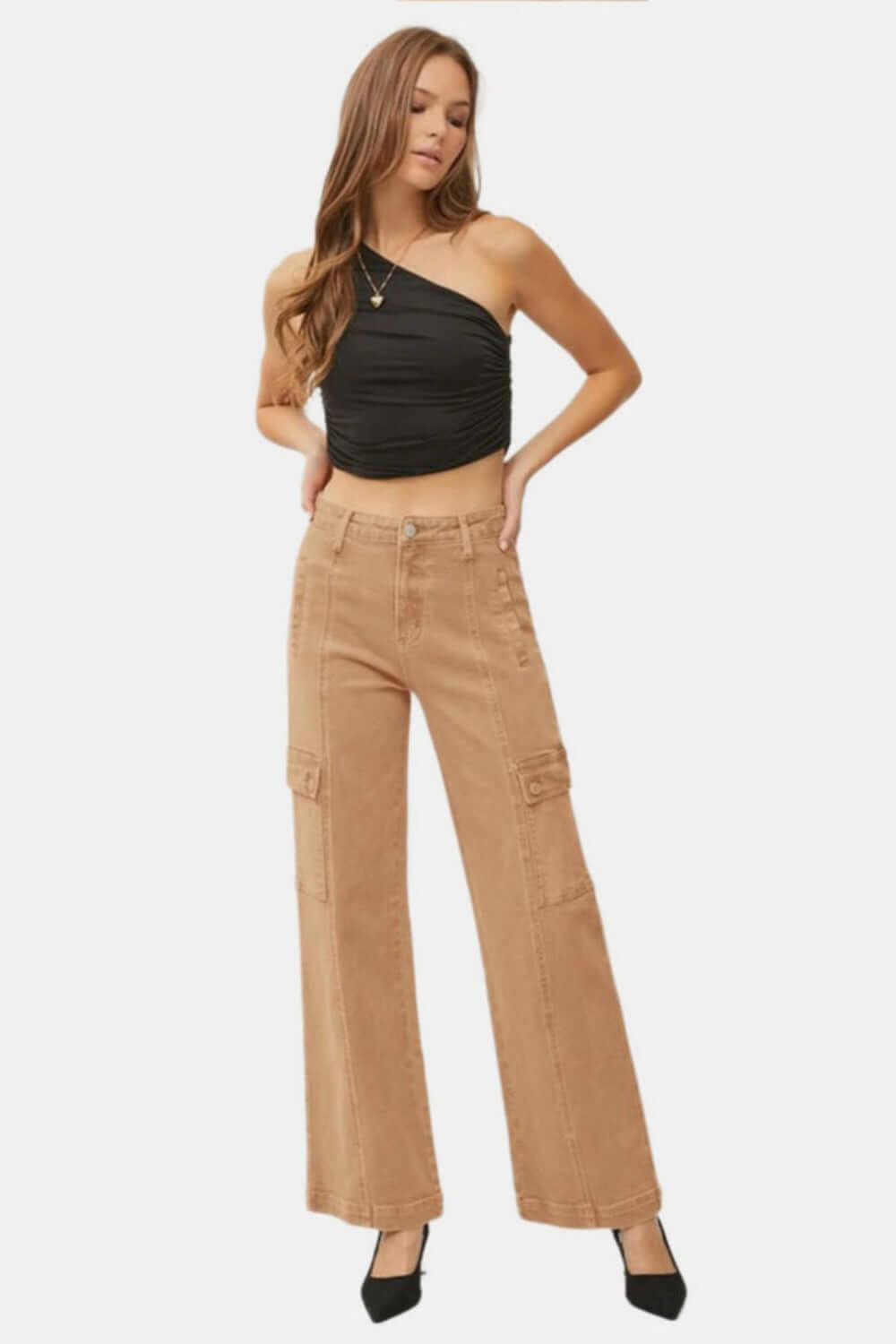 Woman wearing high-rise wide leg cargo jeans with black one-shoulder top, showcasing a stylish and trendy casual look.