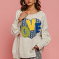 Charming BiBi LOVE heart patch sweatshirt with playful colors and cozy French terry fabric, perfect for casual wear.