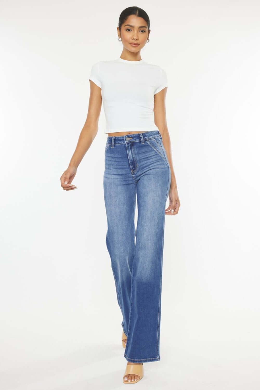 Ultra high waist gradient flare jeans on model, showcasing flattering silhouette and fashionable design.