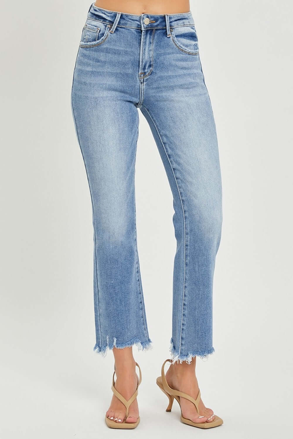 Risen Jeans frayed hem cropped straight jeans in light blue, styled with heels for a trendy and chic casual look.