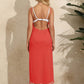 Woman wearing a backless tassel surplice spaghetti strap cover-up dress in vibrant red.