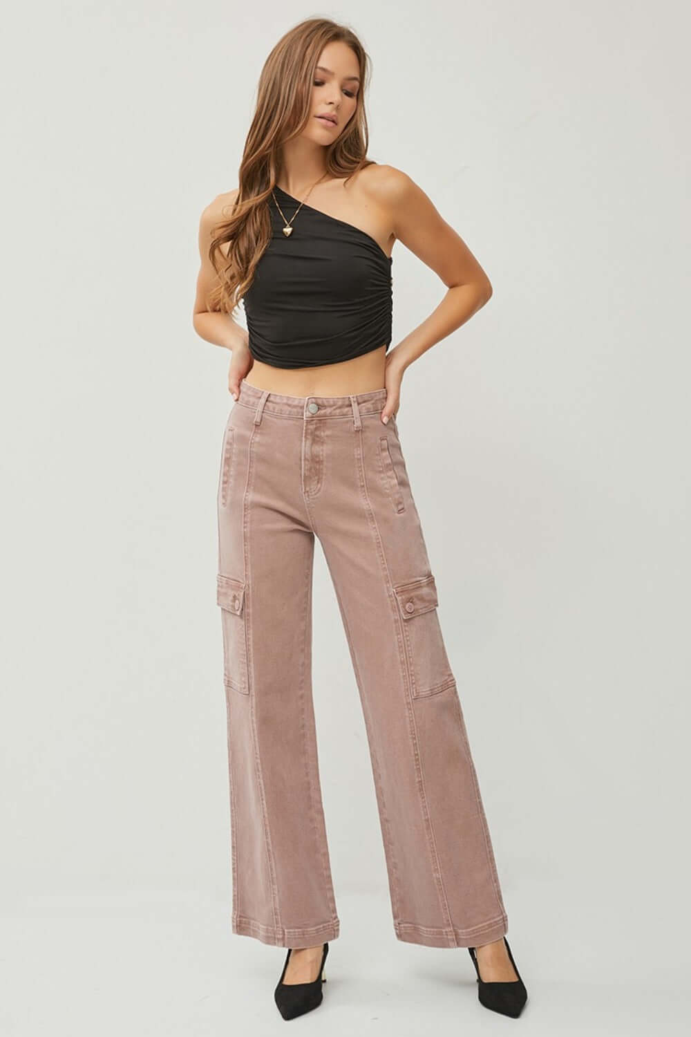 Woman wearing RISEN Full Size High Rise Wide Leg Cargo Jeans with a black top, showcasing trendy style and functionality.