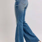 Stylish Judy Blue vintage wash jeans featuring a mid rise and tummy control for a flattering silhouette.