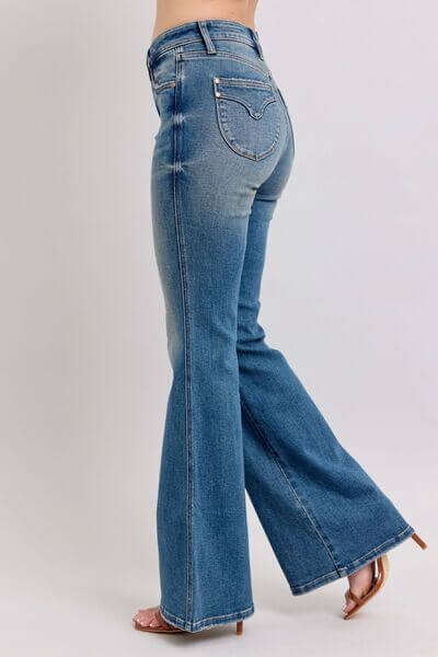 Stylish Judy Blue vintage wash jeans featuring a mid rise and tummy control for a flattering silhouette.