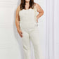 Woman wearing Taylor High Waist Overalls | Full Size by Judy Blue Jeans in solid color, casual style with pockets and long length