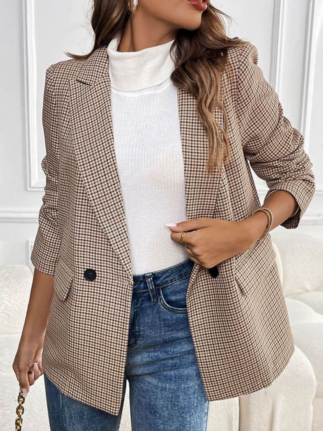 Woman wearing Perfee Plaid Lapel Collar Long Sleeve Blazer with jeans and white turtleneck, showcasing chic and sophisticated style.