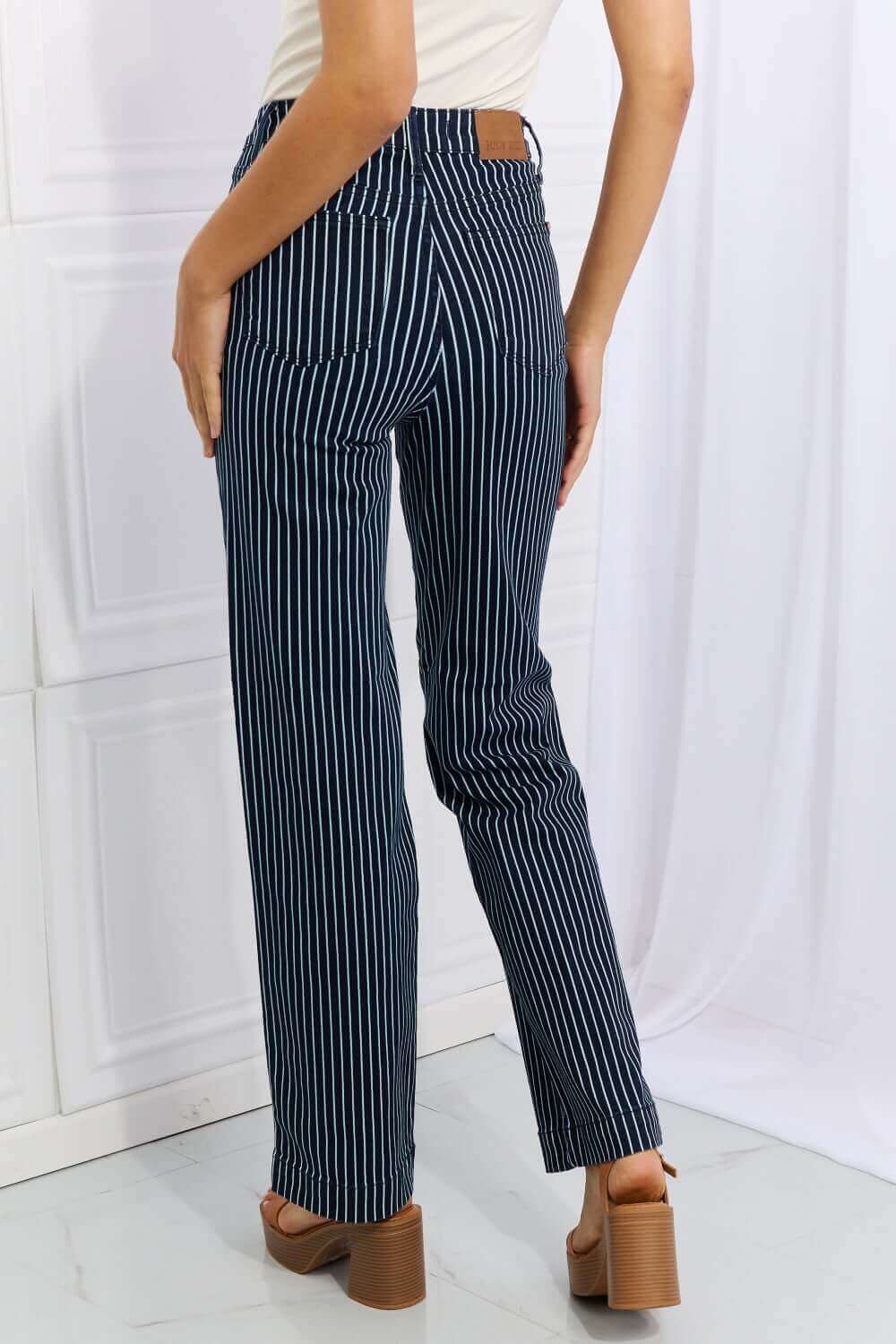 High-waisted Judy Blue Cassidy full size tummy control striped straight jeans, flattering fit from the back, adding sophistication and comfort