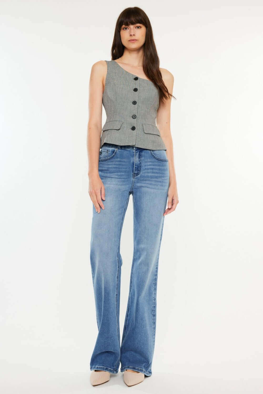 Model wearing Ultra High Rise Cat's Whiskers Jeans with chic high-waisted silhouette and vintage detailing, paired with a stylish grey top.