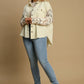 Stylish plus-size model in Umgee distressed button-up jacket with raw hem, paired with light jeans and sneakers.