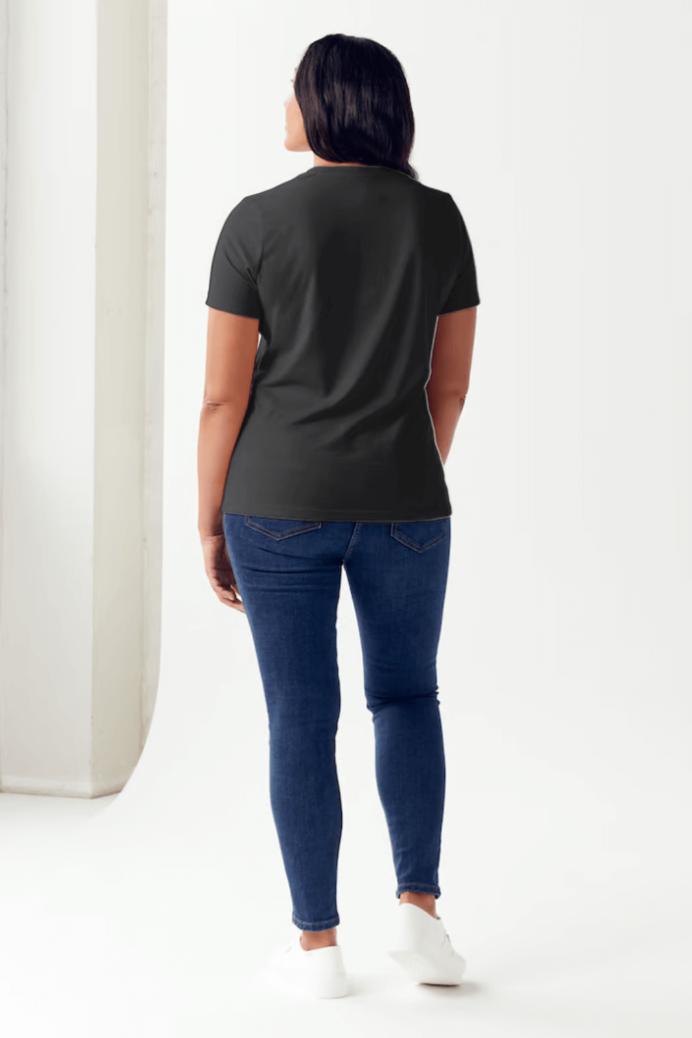 Woman wearing Simply Love LONG LIVE COWGIRLS T-Shirt and jeans, showcasing the back view of the stylish and comfortable tee.