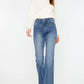 Stylish woman wearing Cat's Whiskers High Waist Flare Jeans, showcasing trendy high waist and flare leg design for a flattering silhouette