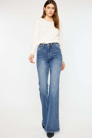 Stylish woman wearing Cat's Whiskers High Waist Flare Jeans, showcasing trendy high waist and flare leg design for a flattering silhouette