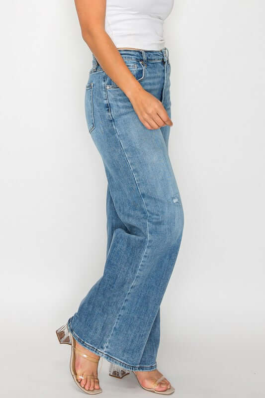 Stylish woman showcasing bytos high rise wide leg jeans with pockets, perfect blend of comfort and flair.