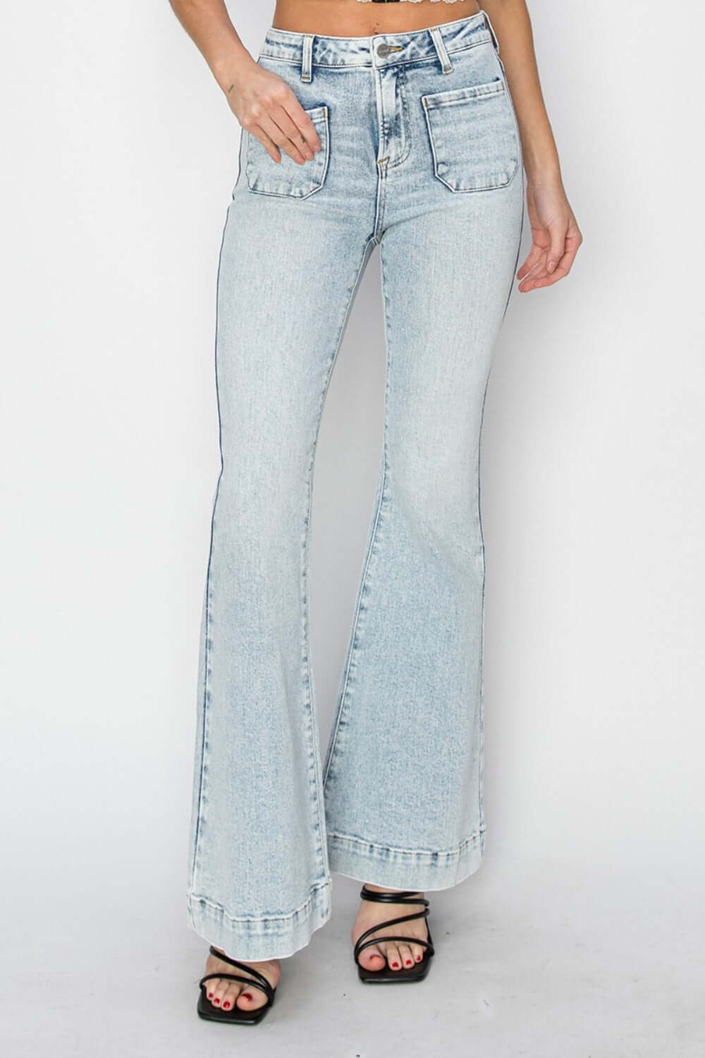 Stylish high rise front patch pocket flare jeans by Risen Jeans, featuring a trendy design with comfortable denim fabric.