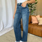 Woman wearing RFM Full Size High Rise Tummy Control Wide Leg Jeans in a casual setting