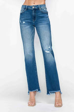 Stylish mid-rise straight jeans with raw hem and distressed details, perfect for a trendy outfit upgrade.