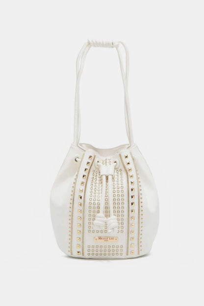 Nicole Lee USA Amy Studded Bucket Bag in white vegan leather with stud and zipper detailing, drawstring closure, and metal feet.