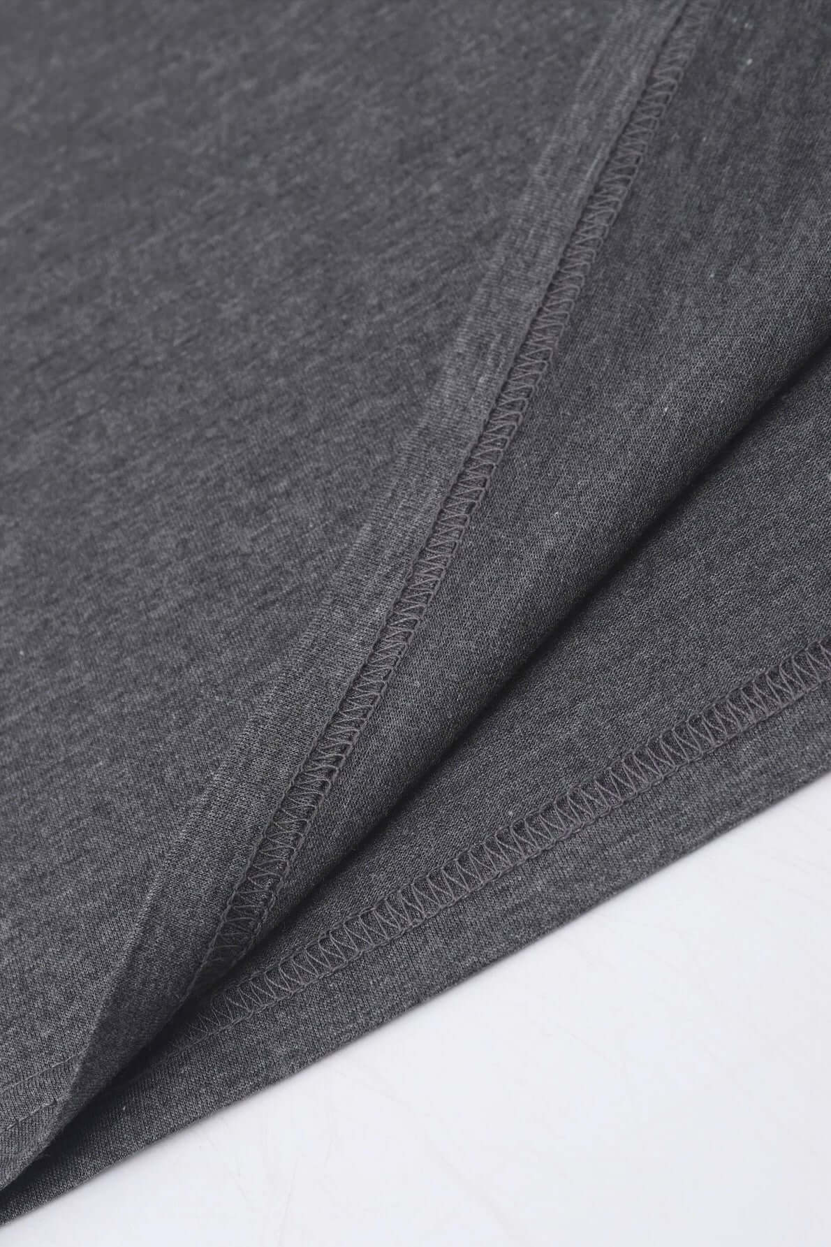 Close-up of the soft, gray fabric of a Bella Road Mardi Gras Graphic T-Shirt, showcasing its quality and comfort.