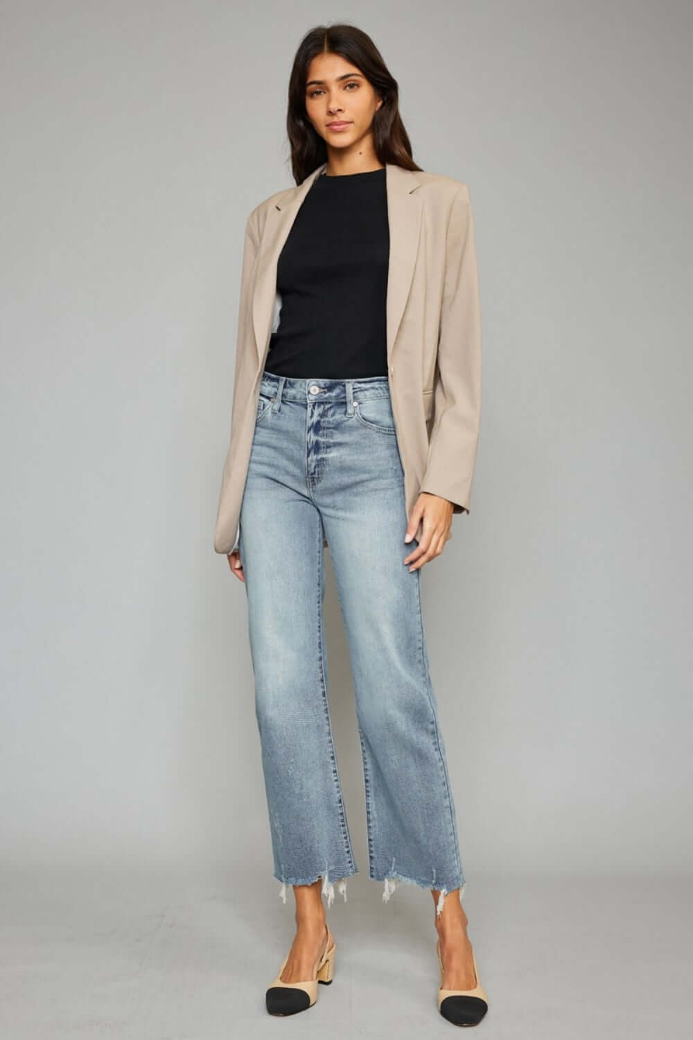 High Waist Raw Hem Cropped Wide Leg Jeans paired with a black top and beige blazer for a trendy, sophisticated look