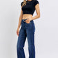 Model showcasing Judy Blue tummy control straight jeans with a sleek fit and stylish comfort.