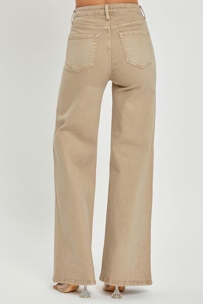 Back view of RISEN full size tummy control high rise wide leg jeans in light beige, showcasing a relaxed fit and stylish silhouette.