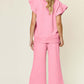 Woman wearing pink Texture Ruffle Short Sleeve Top and Drawstring Wide Leg Pants Set, showing back design.