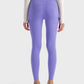 Back view of Millennia Wide Waistband Sports Leggings in lavender, featuring pocketed stretch for comfort and style.