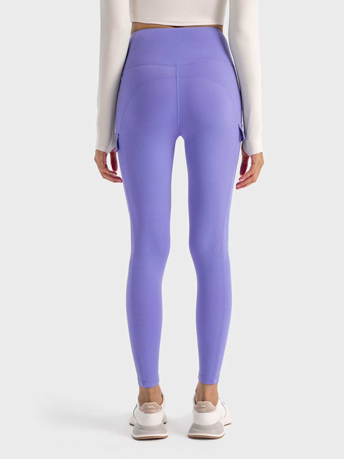 Back view of Millennia Wide Waistband Sports Leggings in lavender, featuring pocketed stretch for comfort and style.