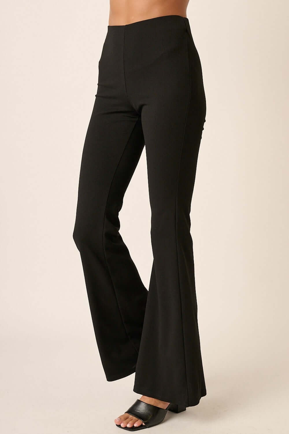 Black Mittoshop crepe knit flare leg pants with elastic waist showcase stylish design and comfort for versatile wear.