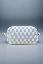 Stylish blue checkered knitted cosmetic pouch with zipper closure, perfect for organizing makeup essentials.