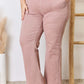 High Rise Ankle Flare Jeans in pink, featuring a pocketed design and slightly stretchy material. Perfect for a flattering silhouette. Risen Jeans.