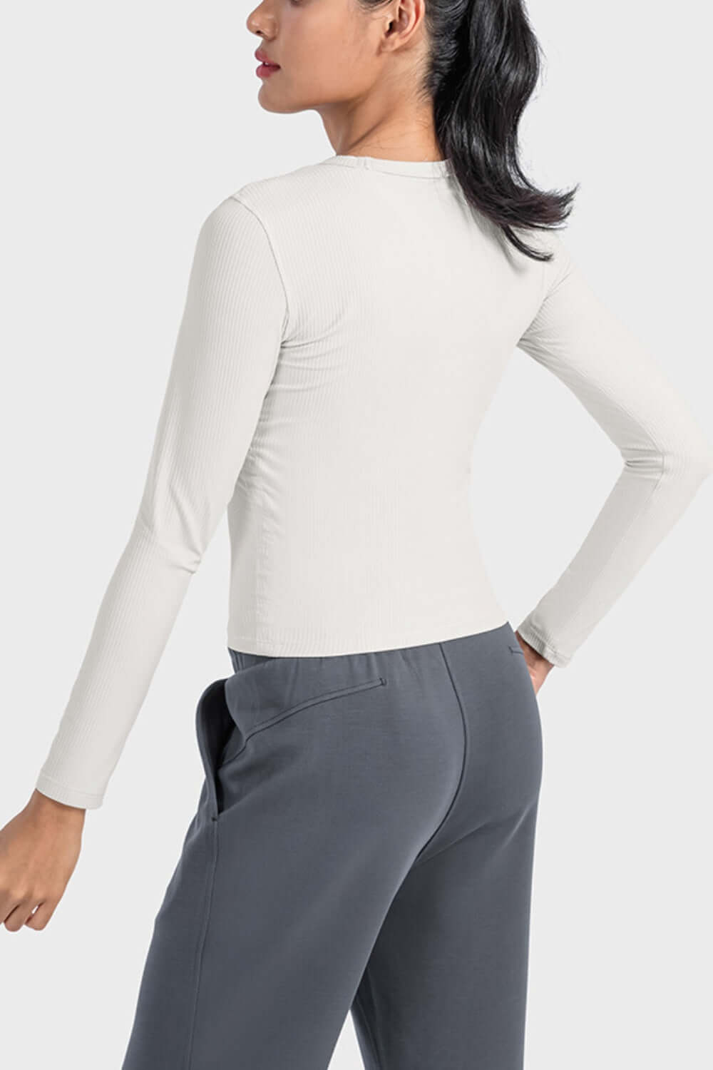 Millennia Round Neck Long Sleeve Sports Top in lightweight fabric, perfect for workouts and casual lounging, shown from the back.