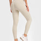 Model showing off Millennia Highly Stretchy Wide Waistband Yoga Leggings in light beige, perfect for a flexible workout.