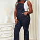 Woman wearing High Waist Classic Denim Overalls by Judy Blue Jeans, showcasing vintage charm with modern trends in a flattering silhouette.