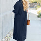 Woman wearing Open Front Long Sleeve Cover Up in black, walking outdoors, back view