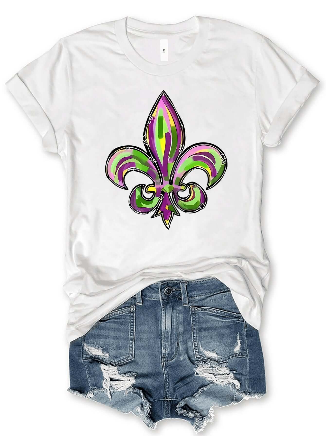 Bella Road Mardi Gras T-Shirt featuring colorful fleur-de-lis graphic, styled with ripped denim shorts for a fun look.