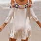 Woman wearing crochet cold shoulder three-quarter sleeve cover up on beach