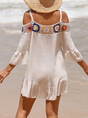 Woman wearing crochet cold shoulder three-quarter sleeve cover up on beach