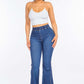 Woman wearing high waist curvy flare jeans with an elastic banded waist and flare bottom. Stylish and trendy jeans for accentuating curves.