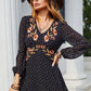 Bella Road embroidered V-neck long sleeve dress with floral design, styled with a wide-brim hat outdoors.