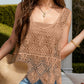 Woman in a brown Bella Road Swim Cutout Cover-Up, wearing a hat and enjoying a sunny outdoor setting.