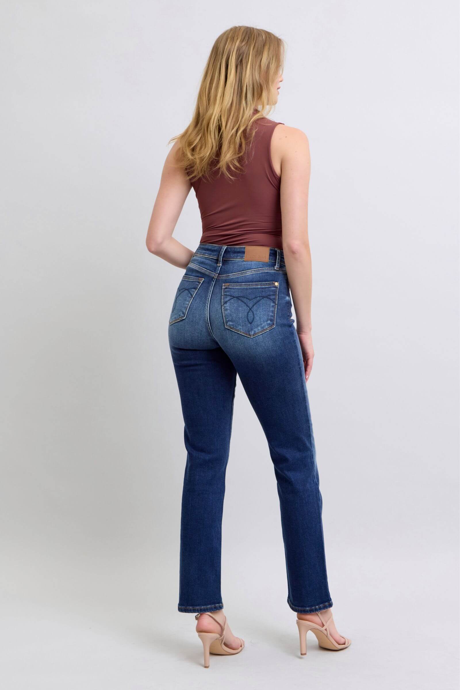 Judy Blue washed straight leg jeans with pockets, showcasing a flattering silhouette from the back. Perfect for casual wear!