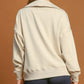 Back view of Umgee Johnny Collar Dropped Shoulder Sweatshirt in light beige, showcasing its relaxed fit and modern style.